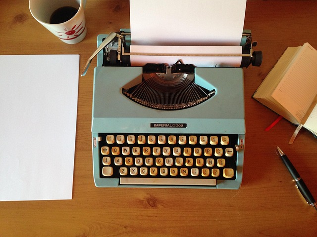 Indian typewriter with a stack of books, symbolizing the publishing process and the transformation of manuscripts into published works.